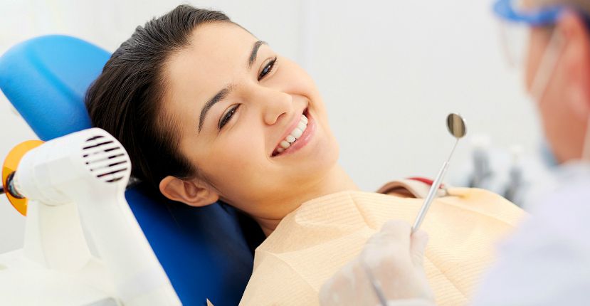 smiling patient looking at the dentist